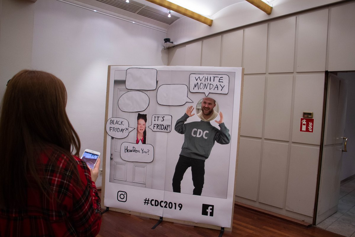 Visitor taking a photo at the booth